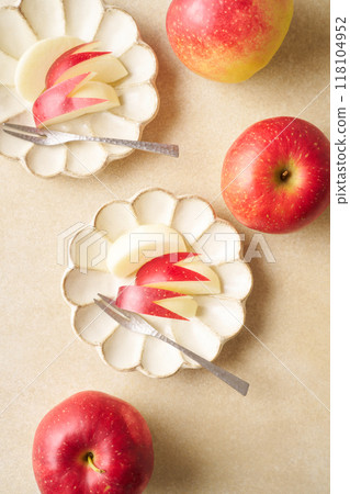 Cut apples on a plate Cut apples on a plate 118104952
