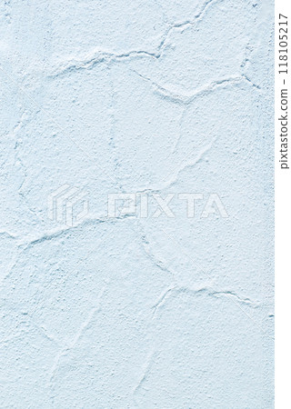 The beautifully textured light white wall features a unique cracked finish that enhances its charm The beautifully textured light white wall features a unique cracked finish that enhances its charm 118105217