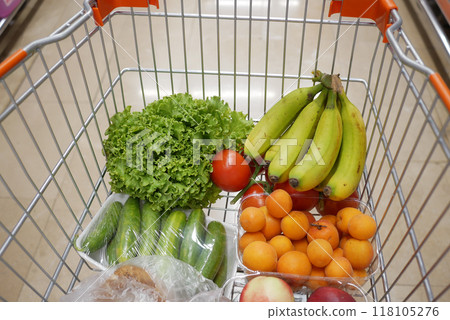 Shopping cart full of groceries . Shopping cart full of groceries . 118105276