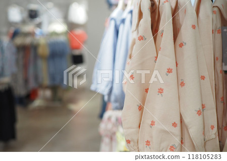 A Chic and Contemporary Display of Apparel Featured in a Modern Clothing Retail Store A Chic and Contemporary Display of Apparel Featured in a Modern Clothing Retail Store 118105283