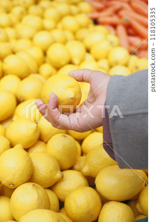 young women choosing Lemon selling in supermarkets in istanbul  118105335