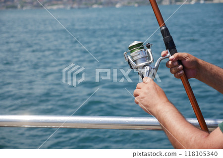 Fisherman with rod, spinning reel , Fisherman with rod, spinning reel , 118105340