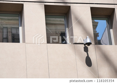 CCTV security camera operating on a building CCTV security camera operating on a building 118105354