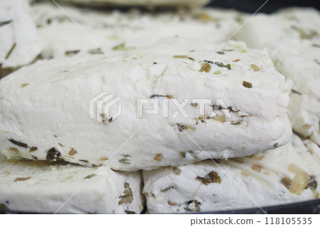Indulge in our Delicious HerbInfused Soft Feta Cheese Blocks for a gourmet experience Indulge in our Delicious HerbInfused Soft Feta Cheese Blocks for a gourmet experience 118105535