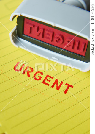 Red URGENT word stamp on a white paper Red URGENT word stamp on a white paper 118105536