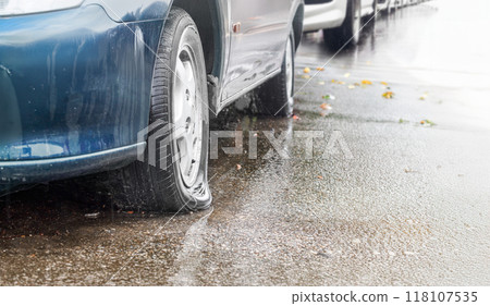 Flat Car Tire on a Rainy Day 118107535
