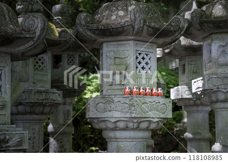 Katsuo-ji Temple: A small Daruma doll placed in a stone lantern 118108985