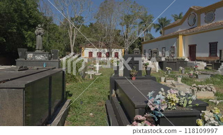 Walking through a Brazilian colonial cemetery with tombstones 118109997