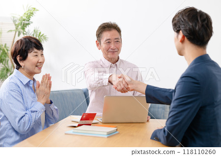 End of life life plan senior couple handshake 118110260