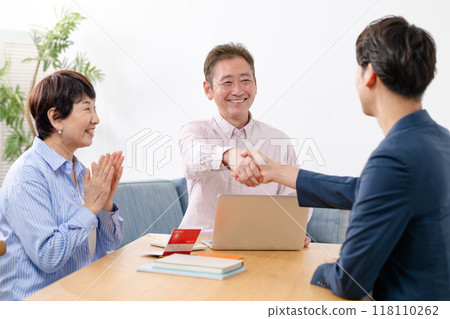 End of life life plan senior couple handshake 118110262