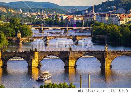 Charles Bridge in Prague with crowds of people at sunset 118110735