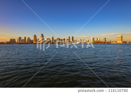 San Diego skyline viewed from Coronado Island across the bay during sunset 118110780