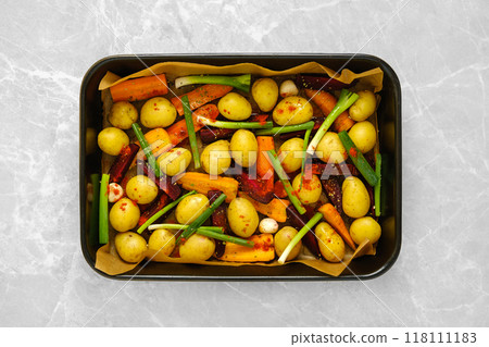 Overhead view of baking tray with fresh vegetables and spices Overhead view of baking tray with fresh vegetables and spices 118111183