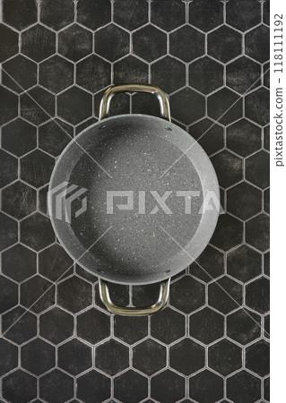 Top view of double handled frying pan on hexagon tile background Top view of double handled frying pan on hexagon tile background 118111192