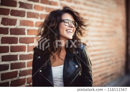portrait of a young beautiful woman against a brick wall, modern style and fashion, lifestyle 118111567