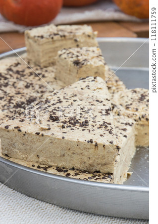 Halva with vanilla and chocolate on stall at bazaar. High calorie snack Halva with vanilla and chocolate on stall at bazaar. High calorie snack 118111759