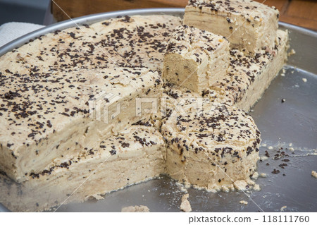 Halva with vanilla and chocolate on stall at bazaar. High calorie snack Halva with vanilla and chocolate on stall at bazaar. High calorie snack 118111760
