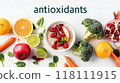 Broccoli, brussel sprouts, strawberry, parsley, currant, orange set isolated on white background with word antioxidants. Immunity booster. Healing food. Flat lay, top view. Design element. Vitamin C 118111915