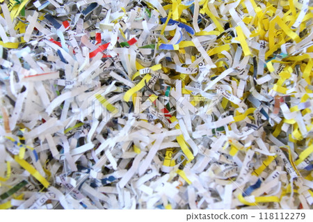 Close-up of documents being shredded 118112279