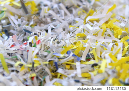Close-up of documents being shredded 118112280