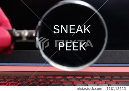 Conceptual sneak peek symbol. Copy space. SNEAK PEEK words written through a magnifying glass on a black monitor background Conceptual sneak peek symbol. Copy space. SNEAK PEEK words written through a magnifying glass on a black monitor background 118112313