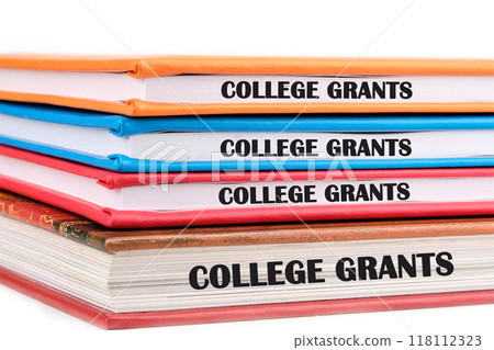 Business and COLLEGE GRANTS concept. Copy space. Grant symbol COLLEGE GRANTS phrase is repeated on the ends of the notebook 118112323
