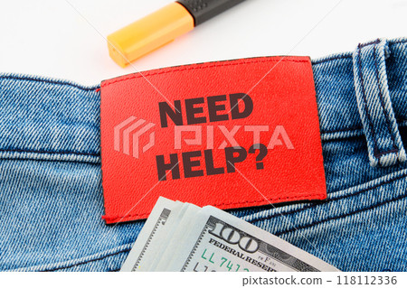 Business and Need Help concept. Copy space. Need Help symbol on the jeans tag Business and Need Help concept. Copy space. Need Help symbol on the jeans tag 118112336