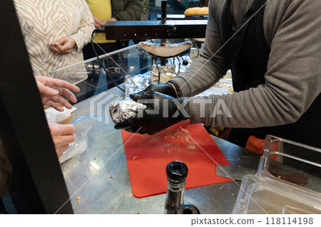 delicious wheel of raclette cheese cutting edge 118114198