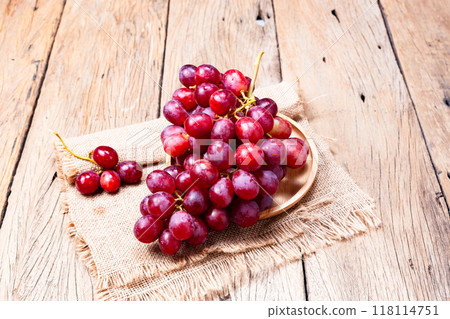 Red grapes on old wooden table background Red grapes on old wooden table background 118114751