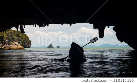 Silhouette tourist people on canoe boat at Tham Lod of Phang Nga bay Silhouette tourist people on canoe boat at Tham Lod of Phang Nga bay 118115196