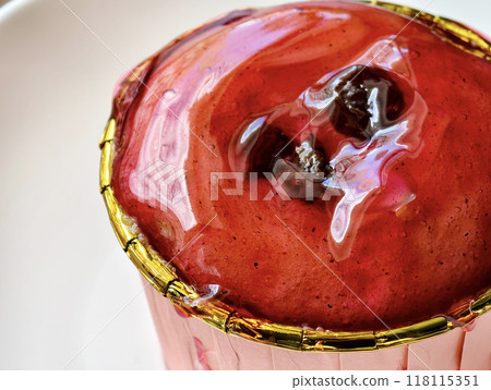 Cupcakes topped with a generous amount of delicious strawberry jelly jam, ready to be served 118115351