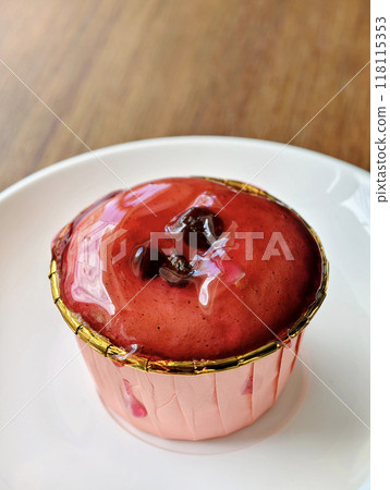 Cupcakes topped with a generous amount of delicious strawberry jelly jam, ready to be served Cupcakes topped with a generous amount of delicious strawberry jelly jam, ready to be served 118115353