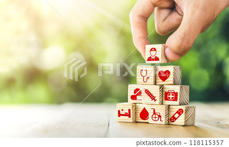 Hand arranged wooden blocks with icons of medical health. health insurance for your health concept. Healthcare medical business, medical technology equipment icon 118115357