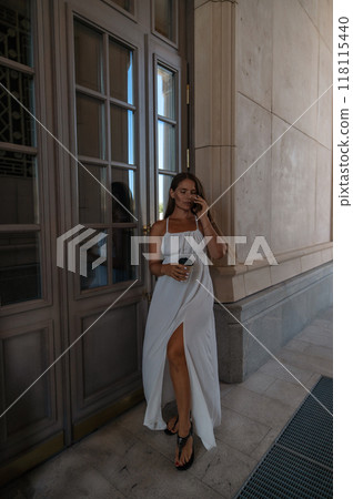 Woman White Dress Phone Building Entrance Woman White Dress Phone Building Entrance 118115440