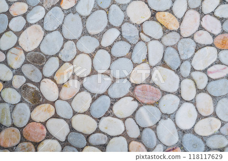Grey background of cobblestone pavement. 118117629
