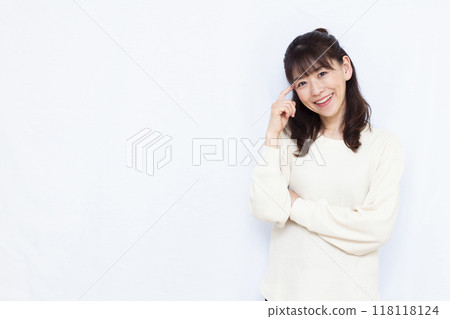 Woman thinking with a smile Woman thinking with a smile 118118124