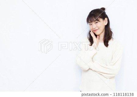 Woman thinking with a smile Woman thinking with a smile 118118138