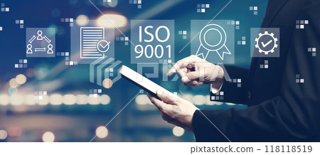 ISO 9001 concept with businessman using a tablet ISO 9001 concept with businessman using a tablet 118118519