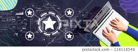 Rating star concept with person using a laptop Rating star concept with person using a laptop 118118549