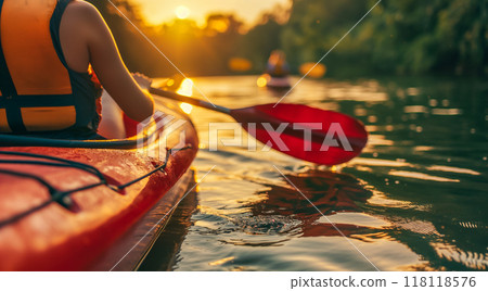 Woman kayaking on a calm river 118118576