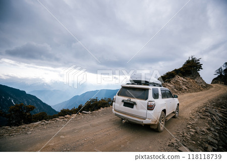 Offroad car running on high altitude mountain trail in tibet, China 118118739