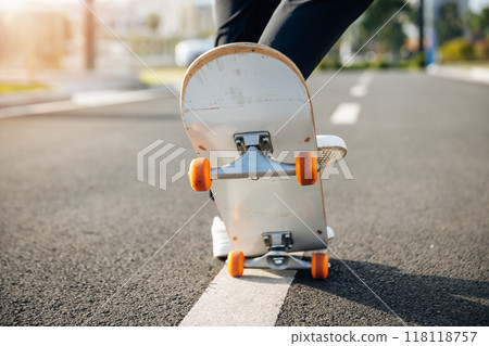 Skateboarder skateboarding outdoors in city 118118757