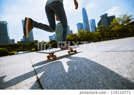Skateboarder skateboarding outdoors in city 118118771