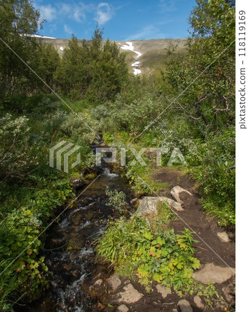 Small stream and Mountains with snow, at Kebnekaise mountain station, Lapland, Sweden. Small stream and Mountains with snow, at Kebnekaise mountain station, Lapland, Sweden. 118119169