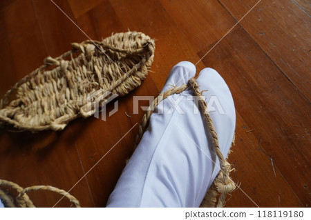 Wearing straw sandals 04 118119180
