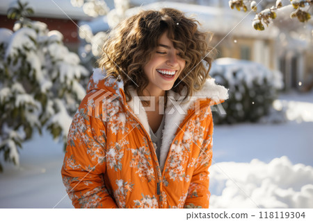 Portrait of a girl in the backyard of a house in winter, snow-covered nature 118119304