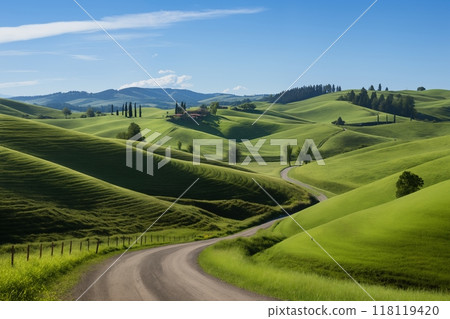 A beautiful summer or spring landscape with green grass on the hills and green fields. The blue sky is filled with white clouds and bright sunlight. Nature as a background. 118119420