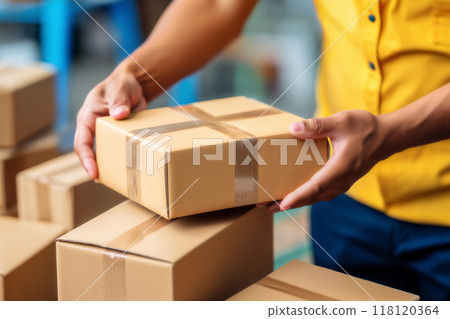 the hands of the loader shift the boxes, the concept of cargo transportation and relocation 118120364