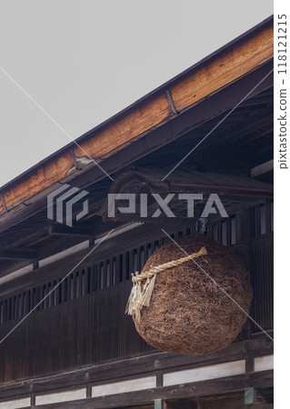 Japan: The townscape of Naraijuku, a vineyard town on the Nakasendo road in Narai, Shiojiri City, Nagano Prefecture. A cedar ball decorated in front of a sake shop 118121215