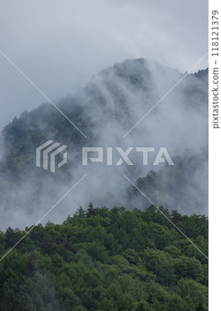 Misty mountains surrounding Naraijuku, a post town on the Nakasendo road in Narai, Shiojiri City, Nagano Prefecture, Japan Misty mountains surrounding Naraijuku, a post town on the Nakasendo road in Narai, Shiojiri City, Nagano Prefecture, Japan 118121379